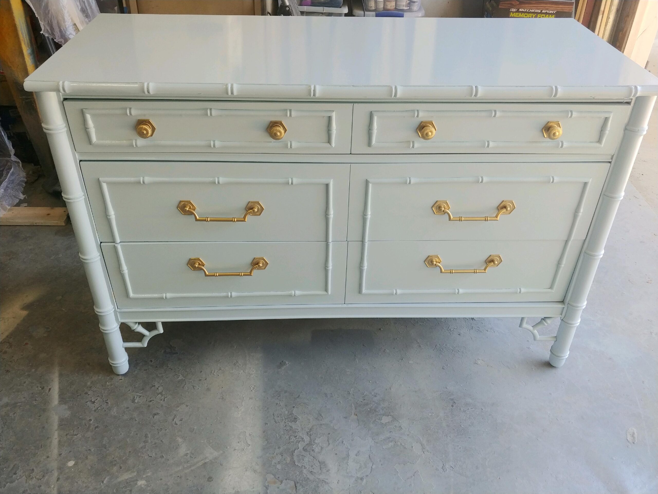 Faux-bamboo dresser finished in soft blue lacquer with brass hardware