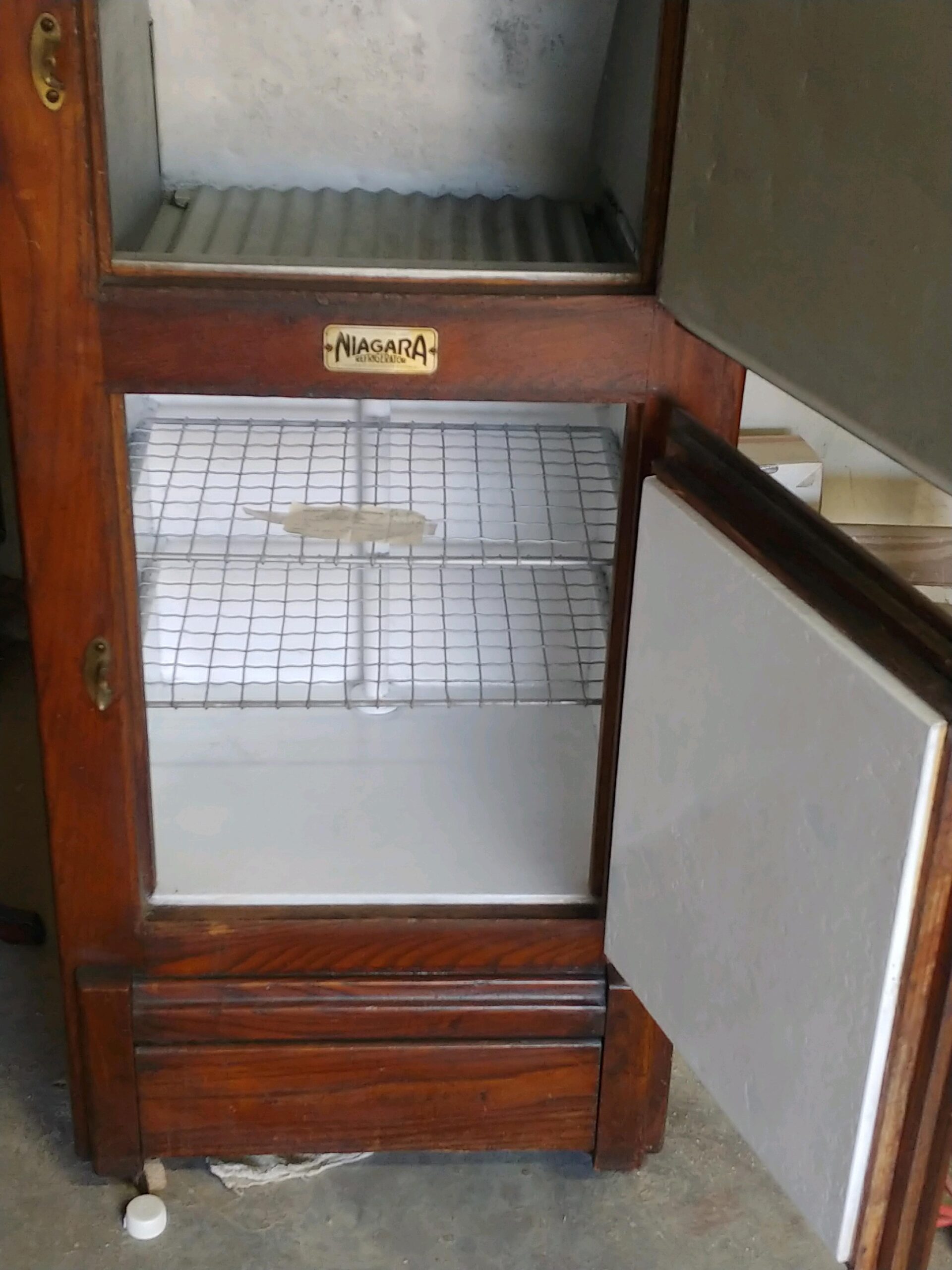 Antique Niagara icebox interior before restoration