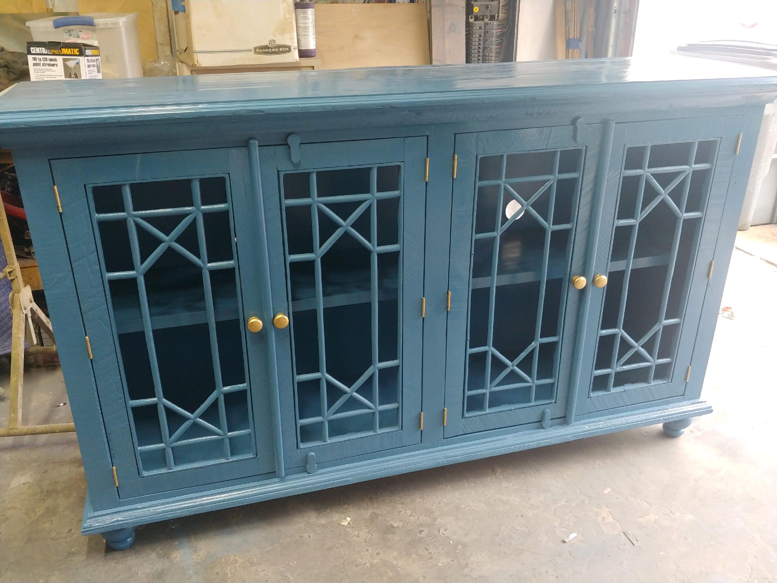 Fretwork glass cabinet finished in blue lacquer