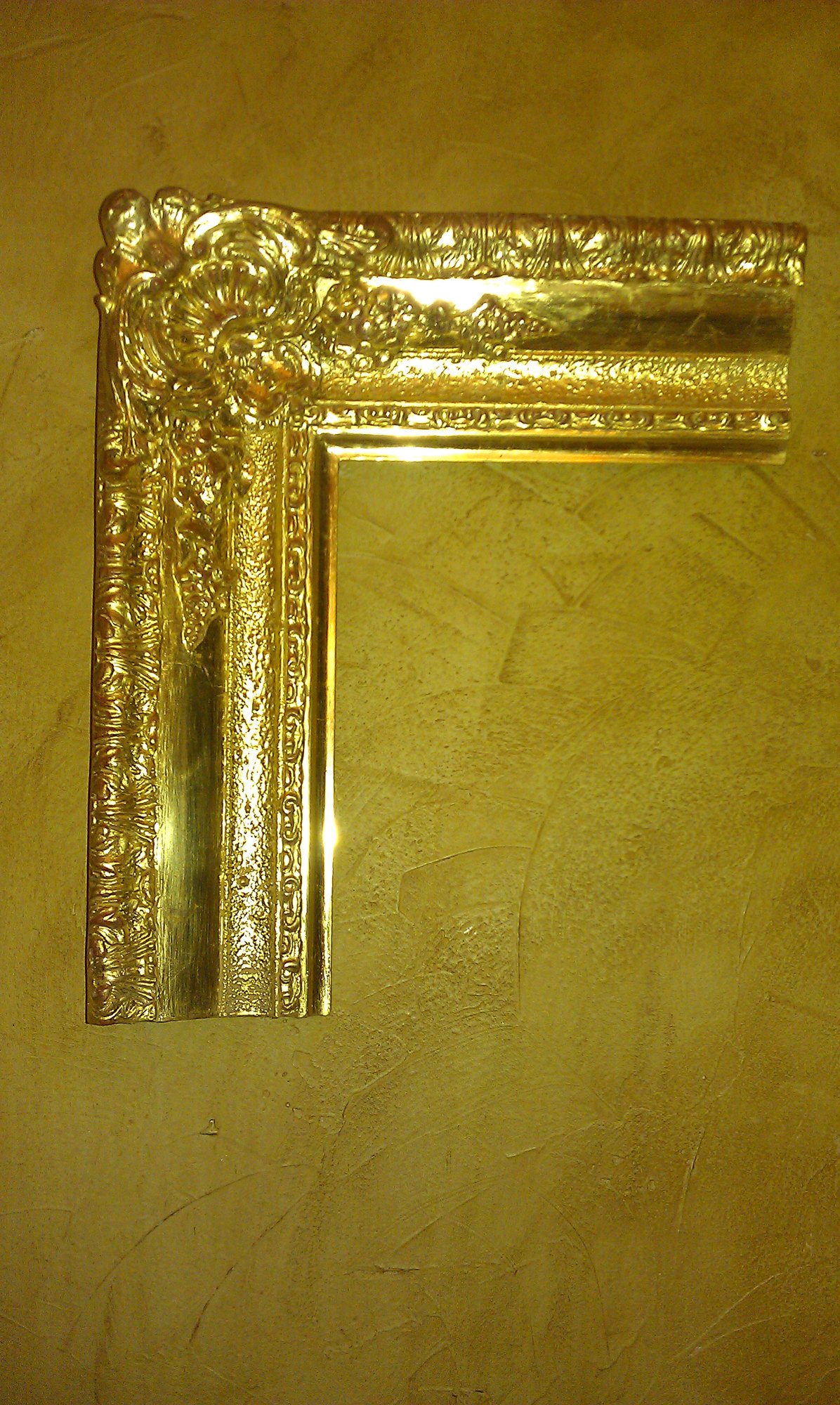 Twenty-two carat water gilded French frame corner sample, deliberately left burnished and bright