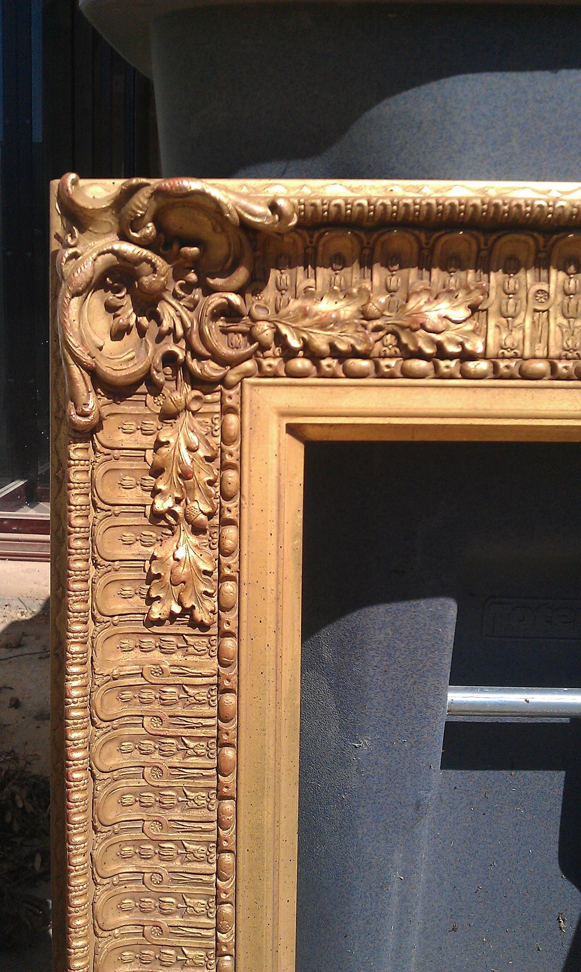 Ornate gilded picture frame corner finished in warm aged gold by The English Refinisher, Dallas