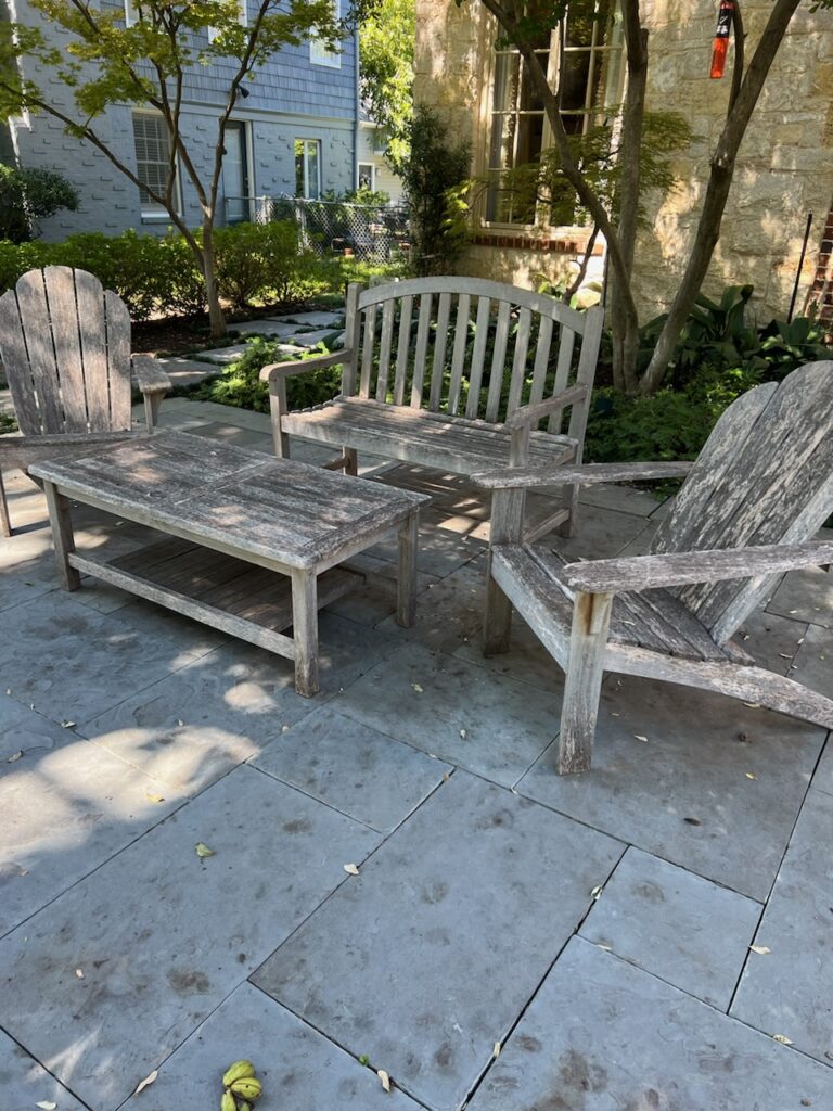Weathered gray teak patio set before restoration, Dallas TX