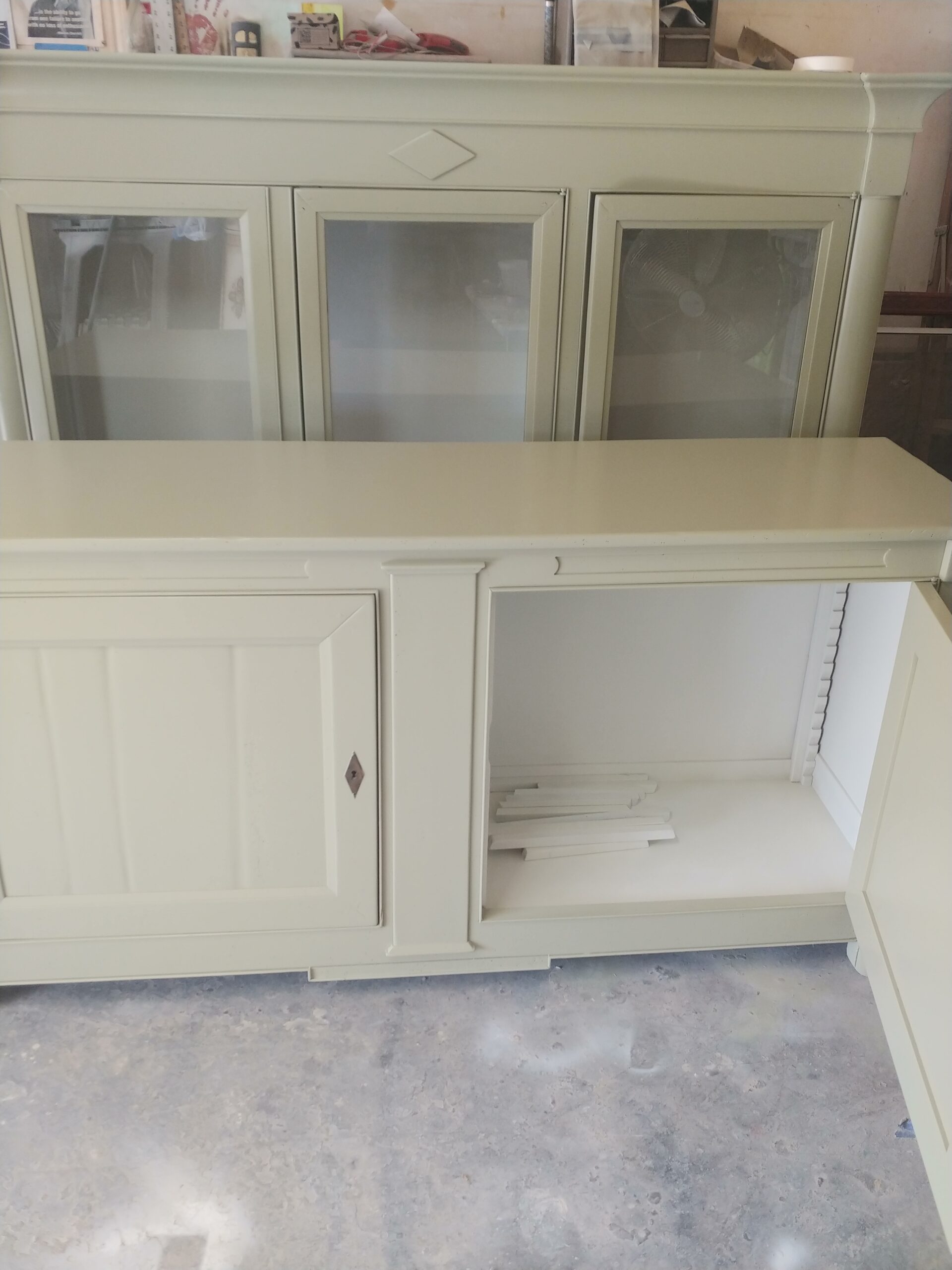 French buffet with a door open showing the lighter Silken Pine lacquer interior and sawtooth shelf supports